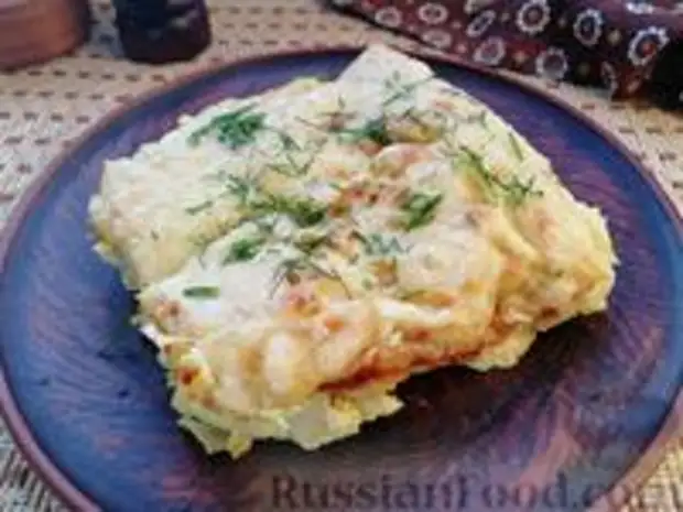 Фото к рецепту: Картофель, запечённый со сметаной и сыром